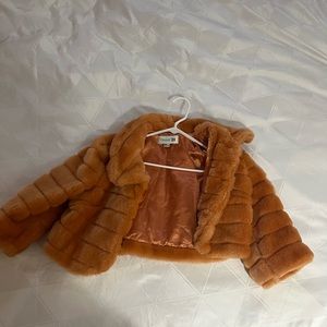Orange lined cropped faux fur jacket